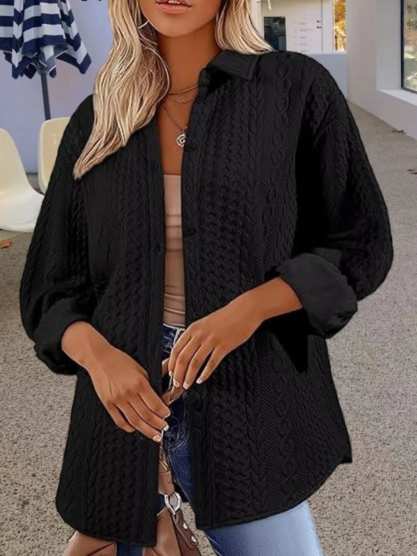 Women's solid colour knitted polyester cardigan sweater in black shown front view