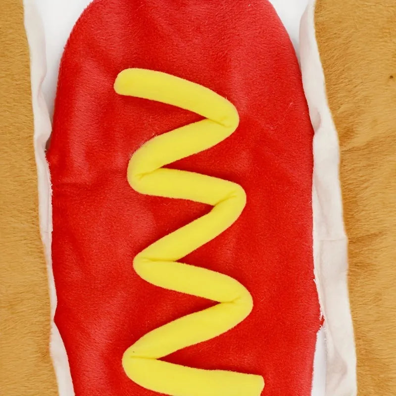 A dog or cat wearing a stuffed brown hot dog costume with bun detail for party cosplay.