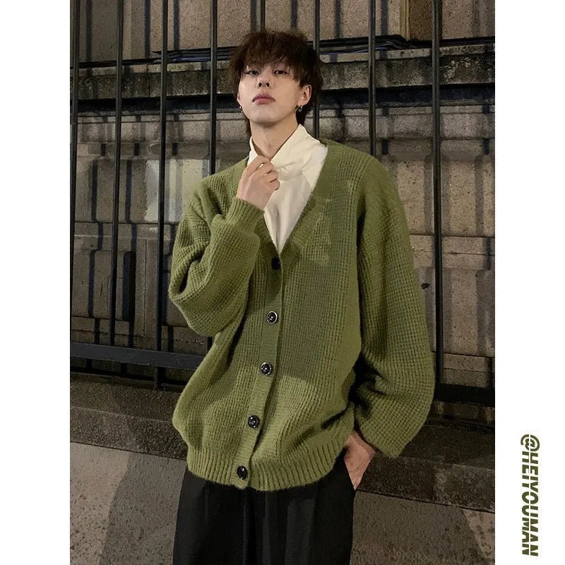 Men's loose-fit V-neck knit cardigan in army green, shown on a hanger.