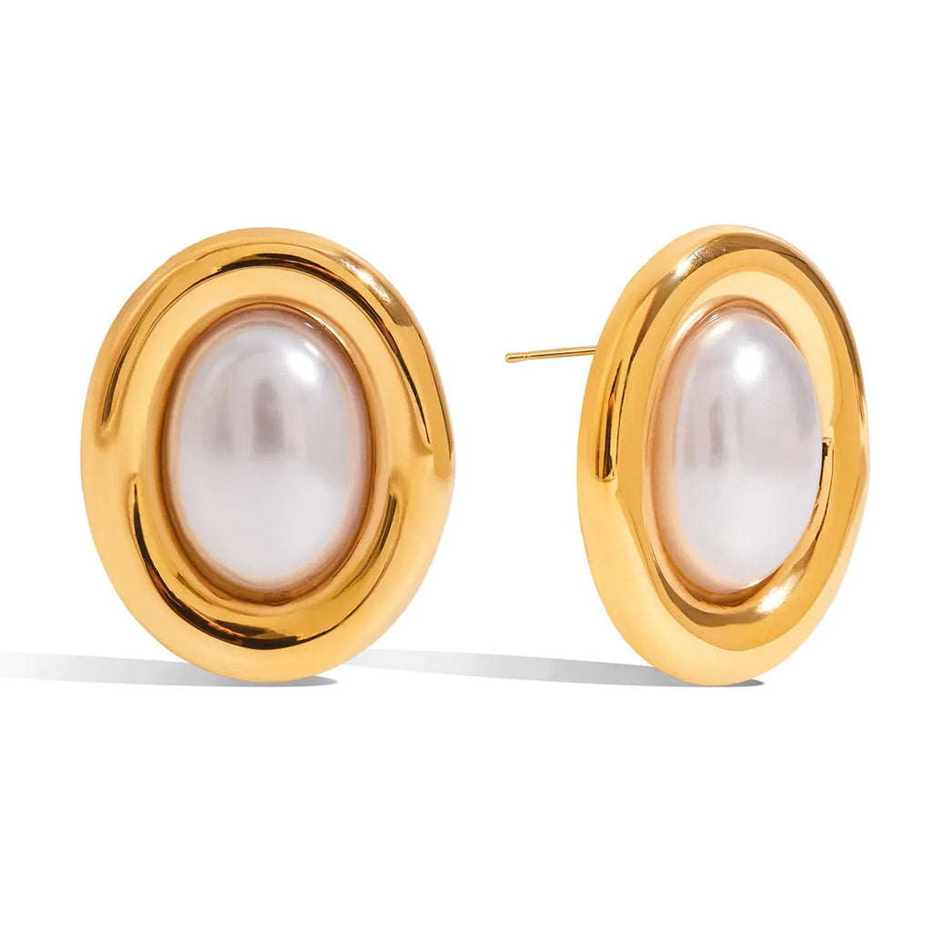 Close-up of women's stainless steel vintage pearl stud earrings with a silver-toned electroplated finish.