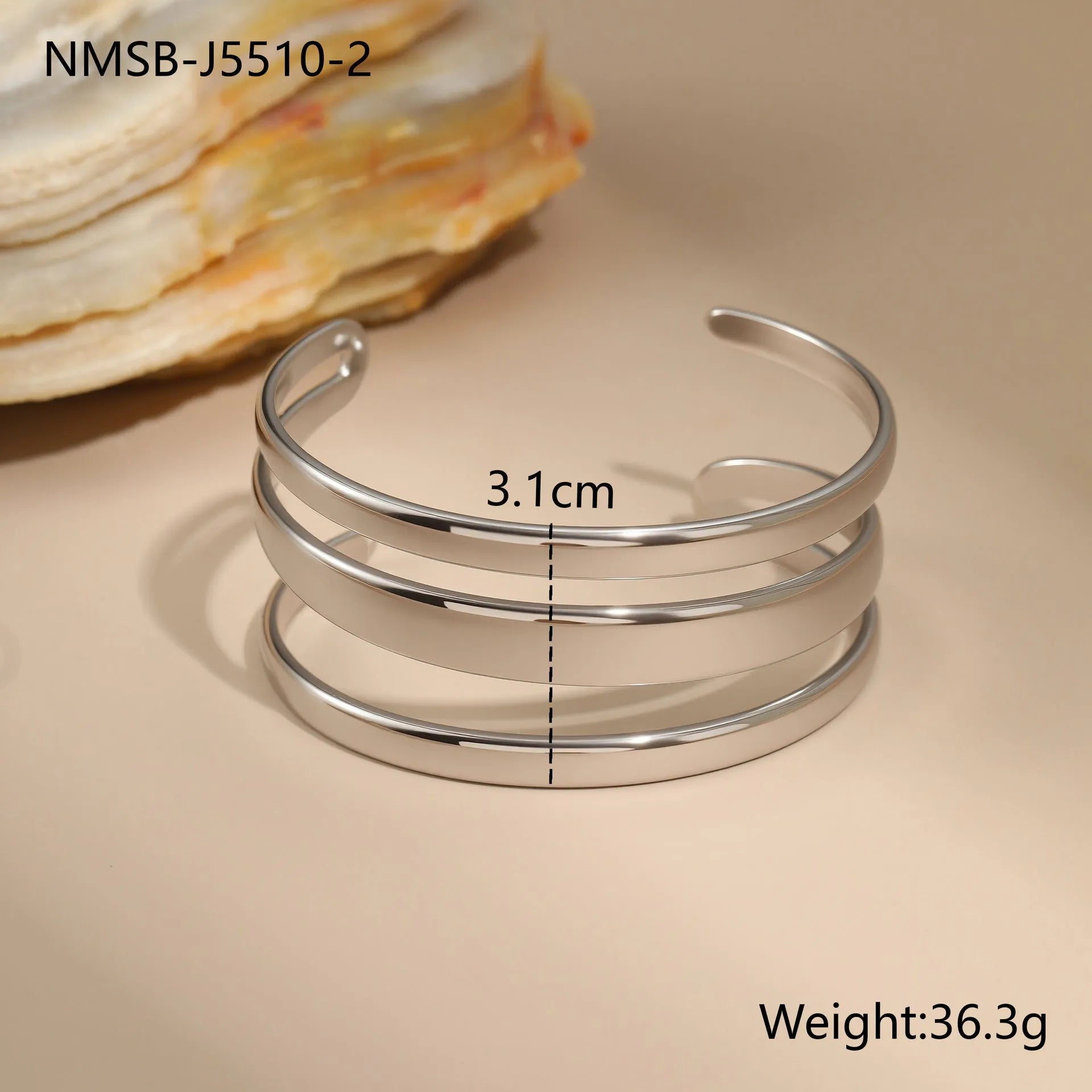 Gold and steel colour geometric line design stainless steel bracelet for women with simple opening clasp.