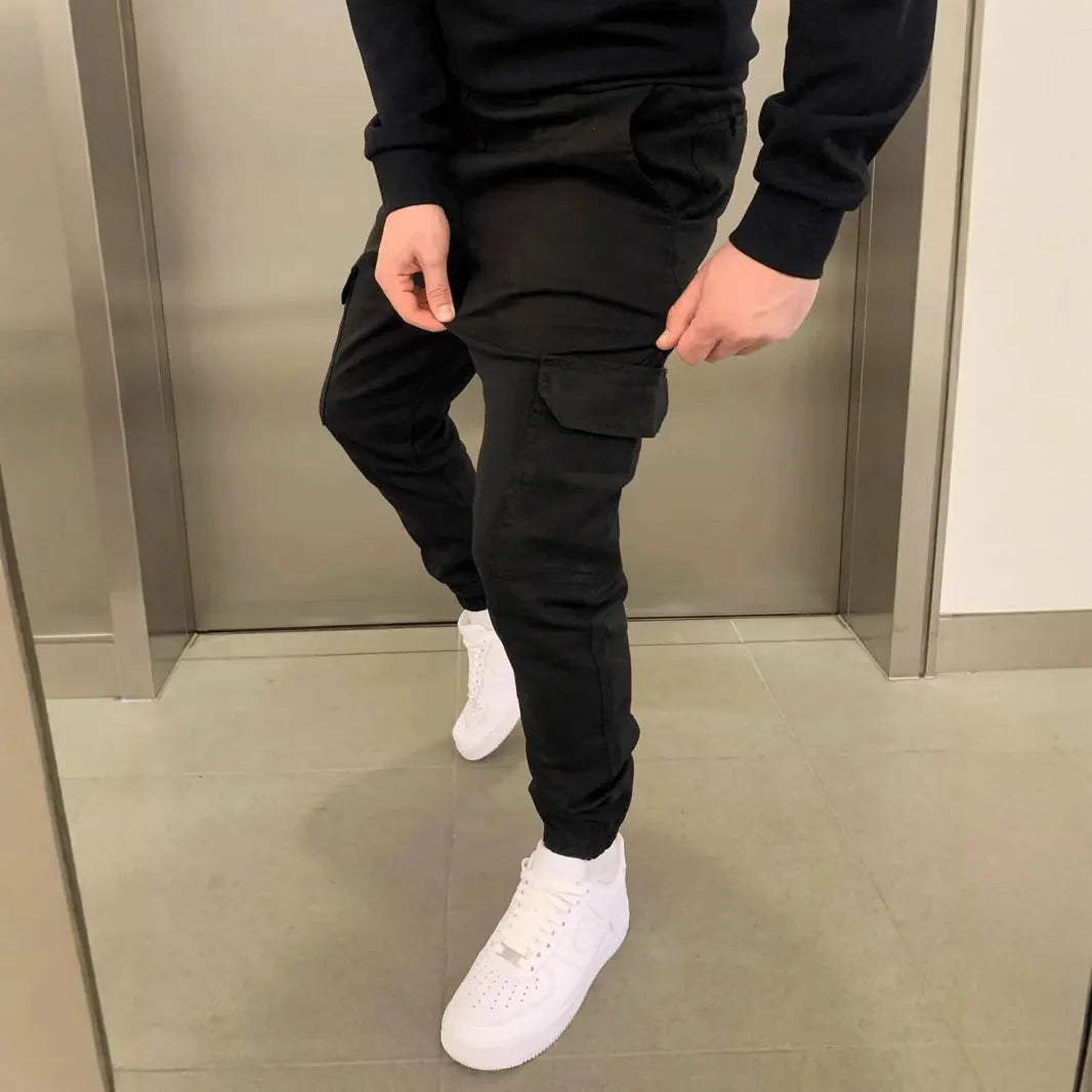 Men's light blue polyester baggy trousers with dimensional patch pockets and straight leg casual styling