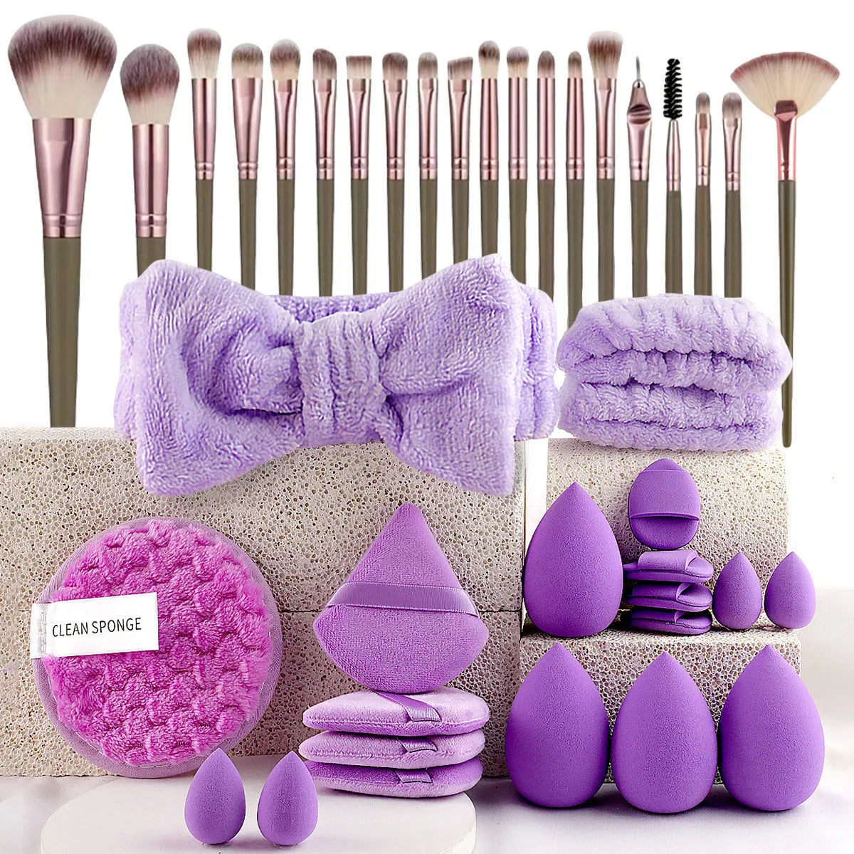 Hydrophilic non-latex beauty tools set with brushes in brown, pink, and purple colours for face washing and makeup
