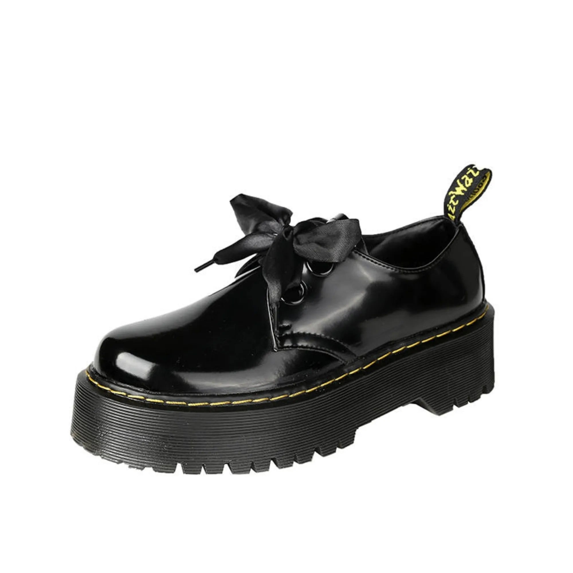 Women's black leather shoes with thick soles, ribbon cross straps, and lacing closure