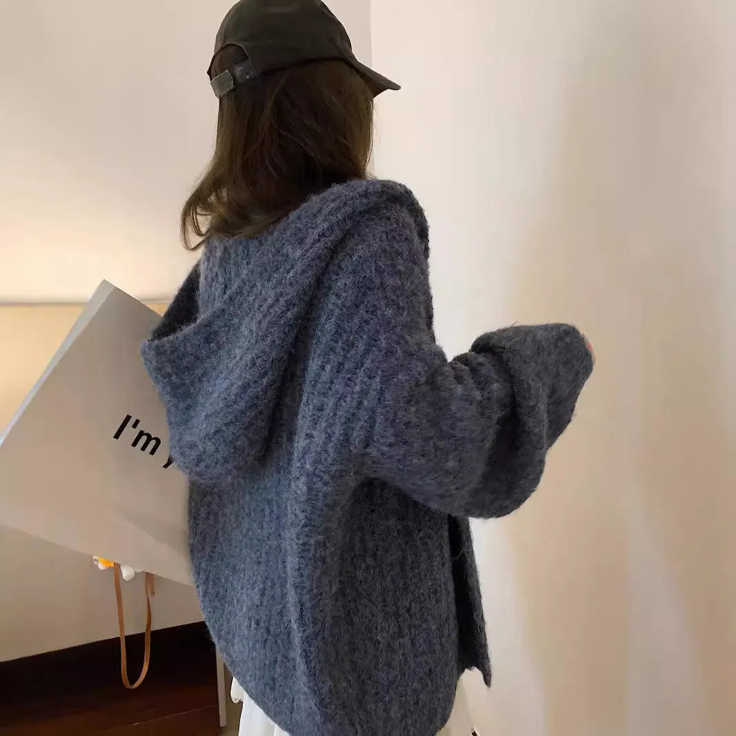 Women's dark grey loose-fit hooded cardigan sweater on a hanger