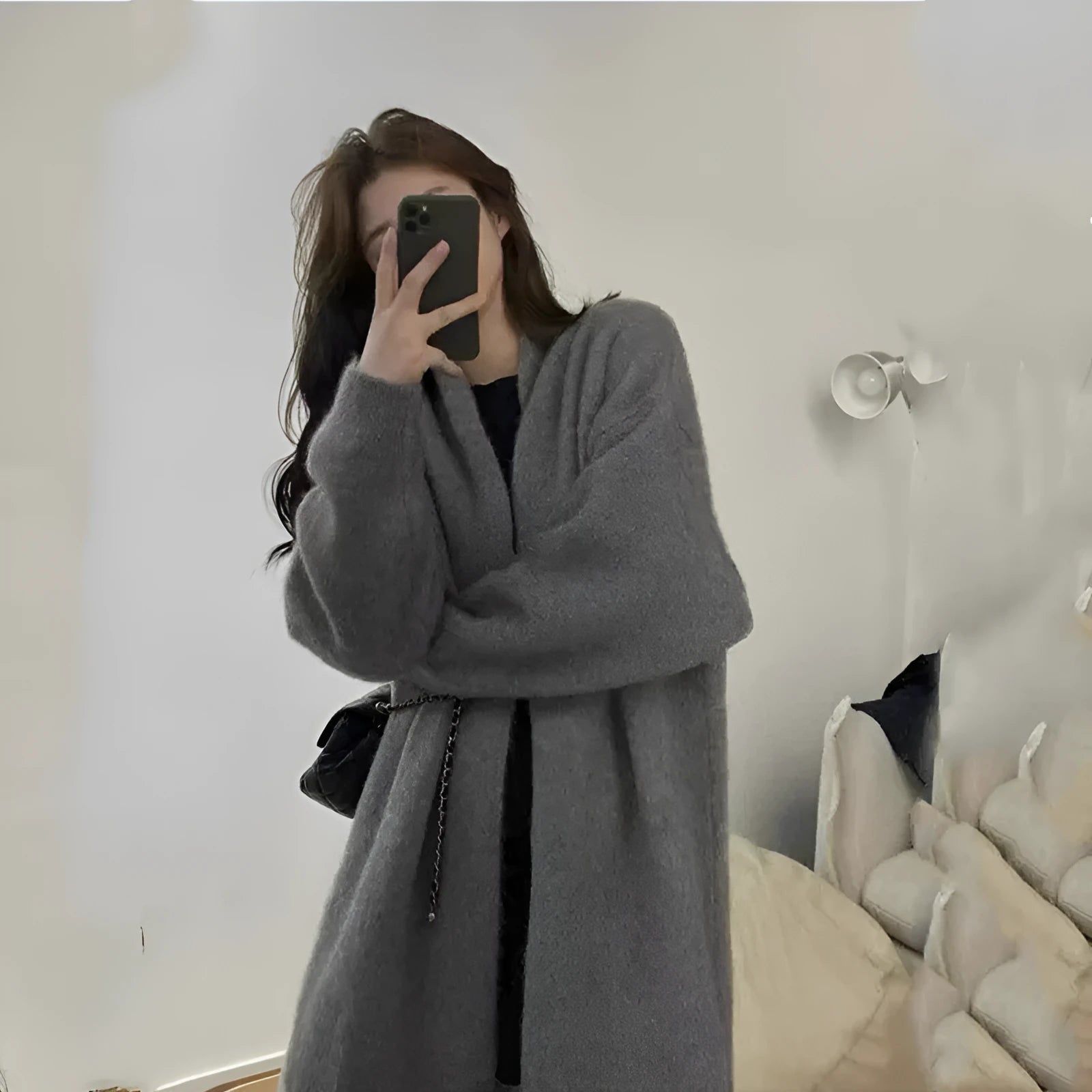 Loose thick chenille cardigan for women in a dark grey colour, showing 3D pattern and mid-length fit.