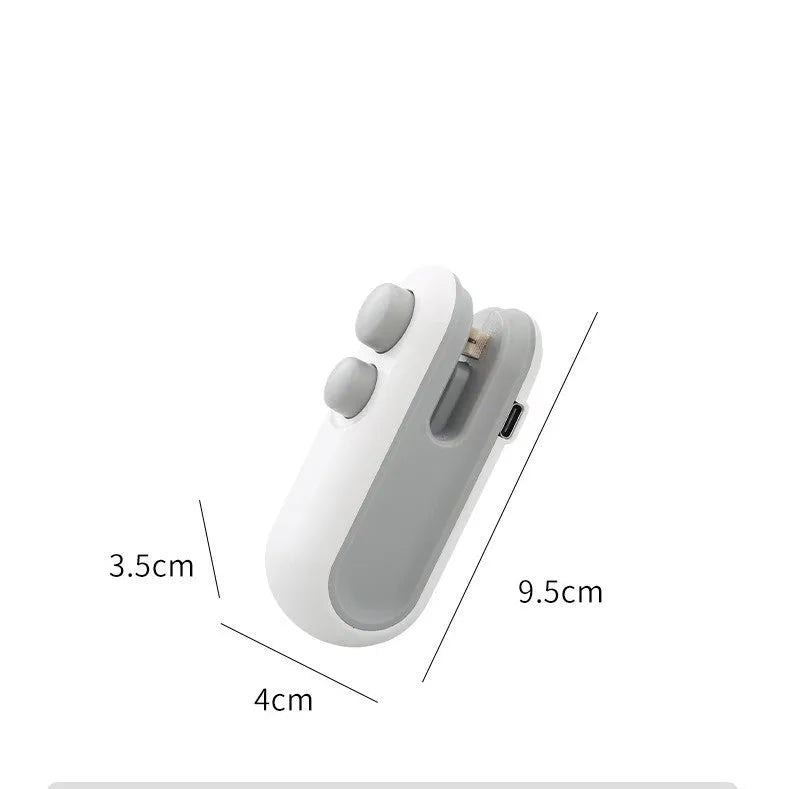 White and blue handheld USB rechargeable heat sealer for sealing food bags with magnetic back.