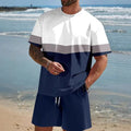 Man wearing a loose blue short-sleeved t-shirt and matching shorts from a summer leisure set.