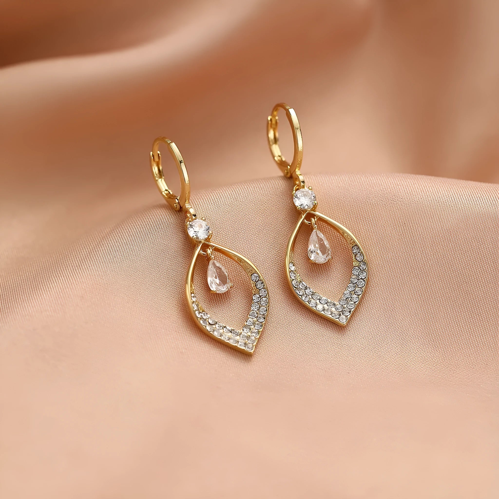Gold and silver zircon teardrop tassel drop earrings on a copper base.