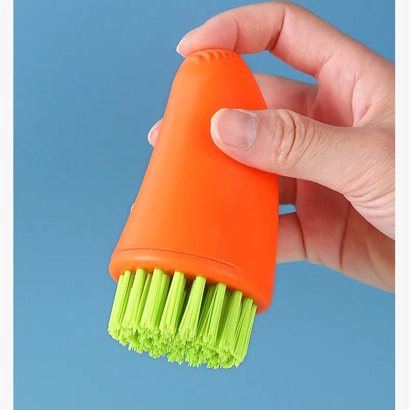 White and orange radish-shaped carrot cleaning brush with nylon bristles for washing root vegetables