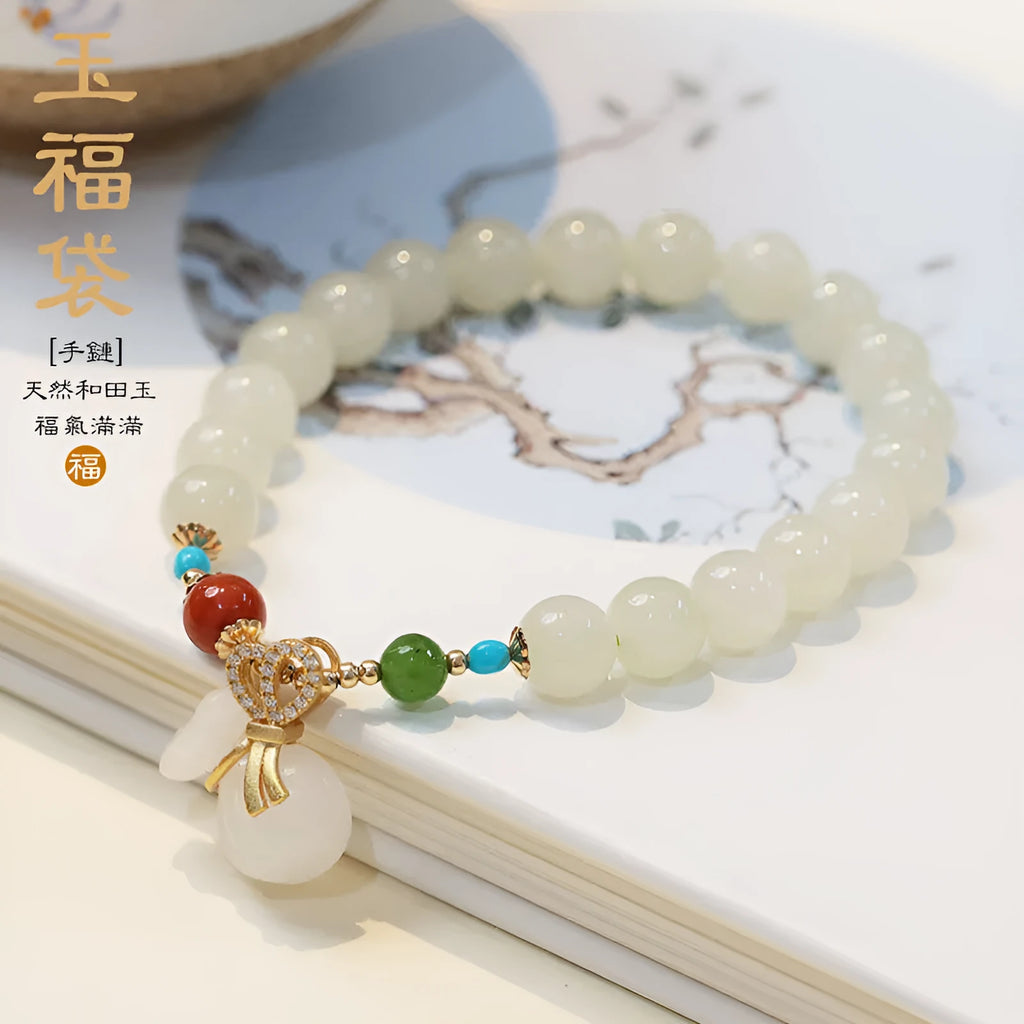 8mm natural Hetian gray jade round bead bracelet on women's wrist, retro style