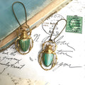 Retro beetle earrings for women, gold metal with electroplated blue finish, creative insect design