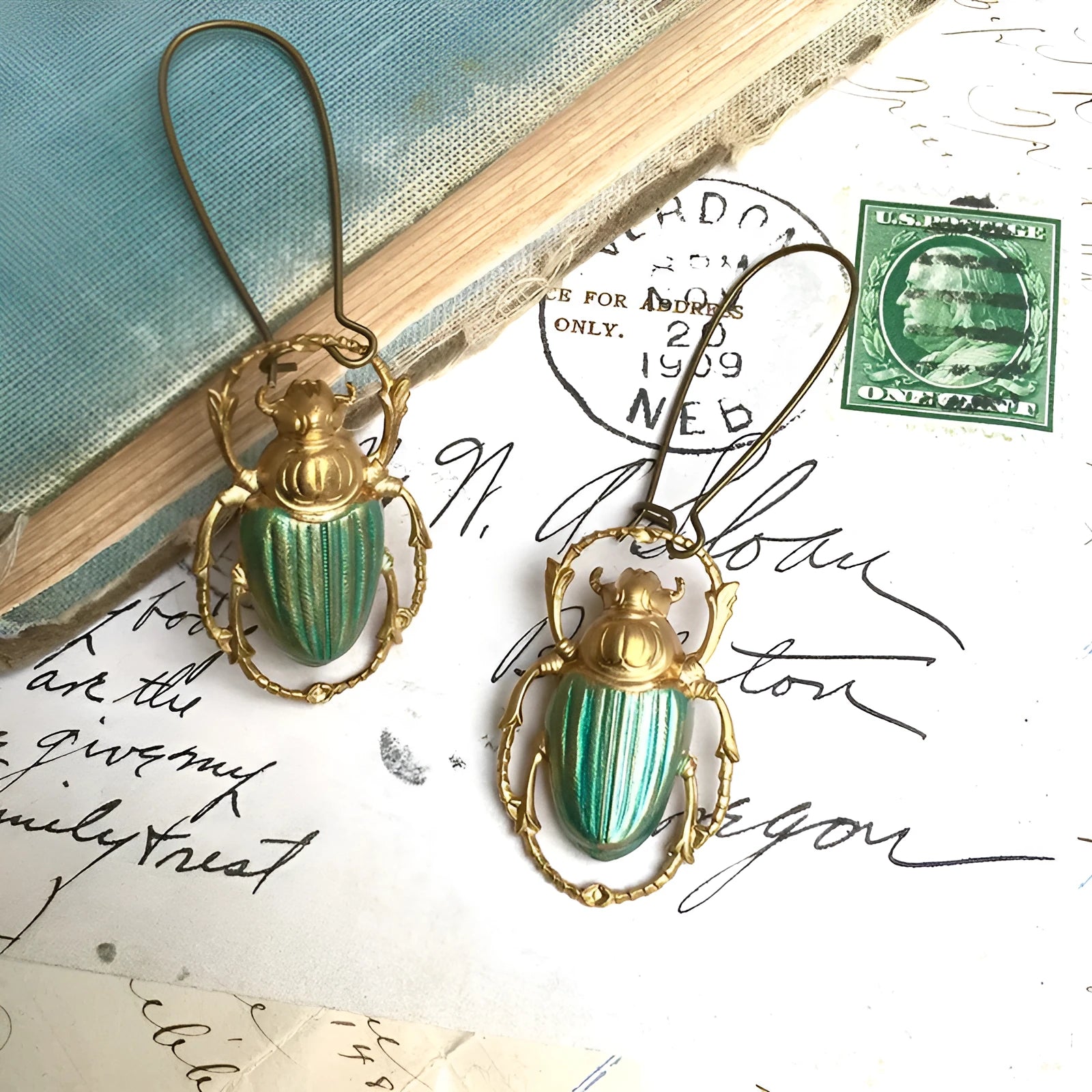 Retro beetle earrings for women, gold metal with electroplated blue finish, creative insect design
