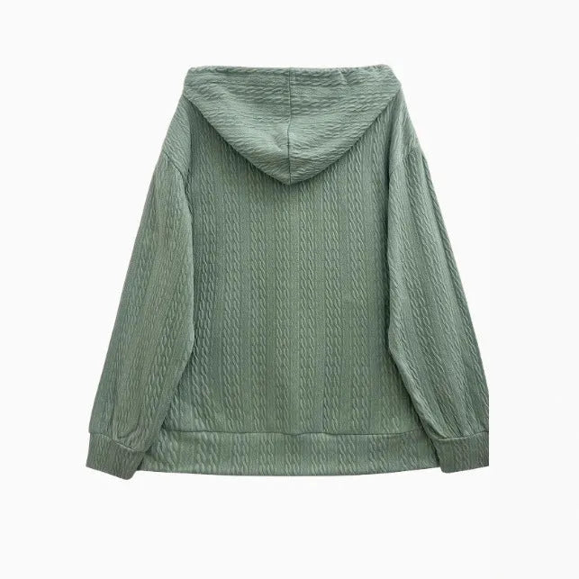 Green loose fit hooded zipper coat for women on a hanger.