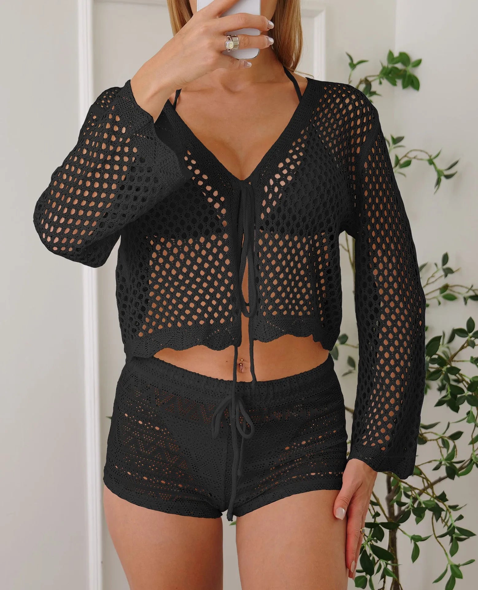 Women's hollow woven cardigan blouse with bell sleeves in short length available in four solid colours
