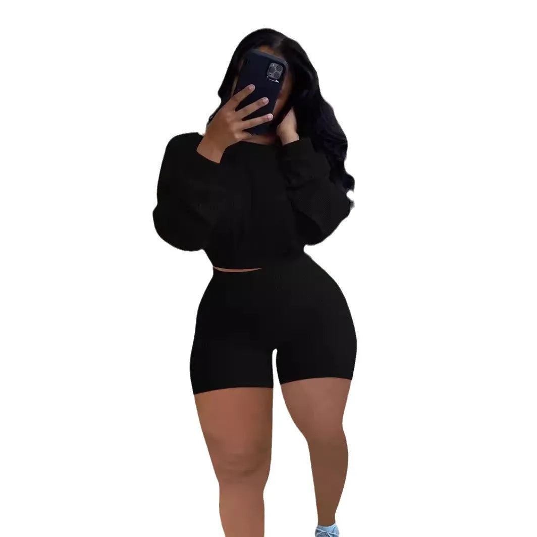 Women's solid colour off-the-shoulder top with sunken stripe detail and matching shorts, a two-piece set with long sleeves.
