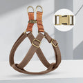 Brown vest-style dog leash harness on small dog showing cotton nylon construction and alloy fastener