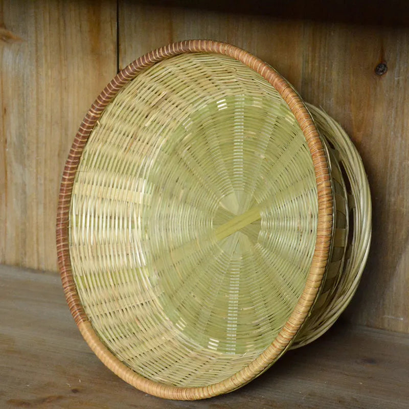 Three handmade bamboo storage baskets in different sizes including one with deepening design