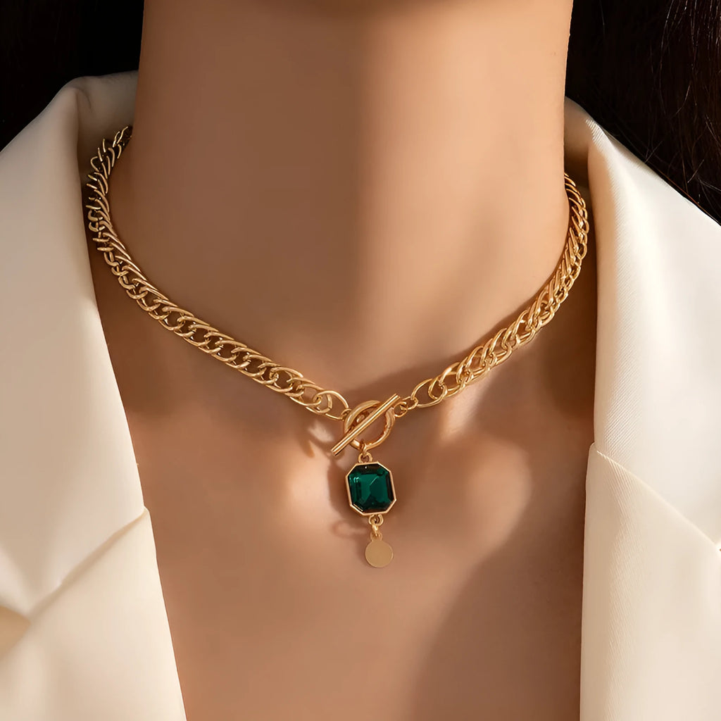 Gold electroplated titanium steel pendant necklace with French retro geometric design and emerald zircon accents