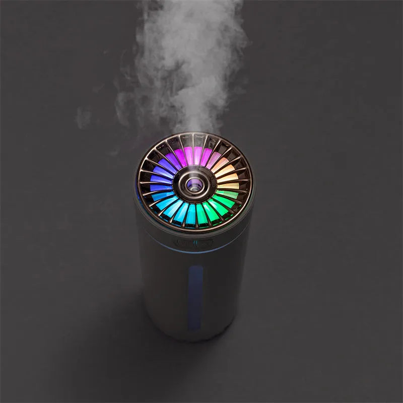 Black and white portable USB rechargeable humidifier with colourful lights for car and desktop use.