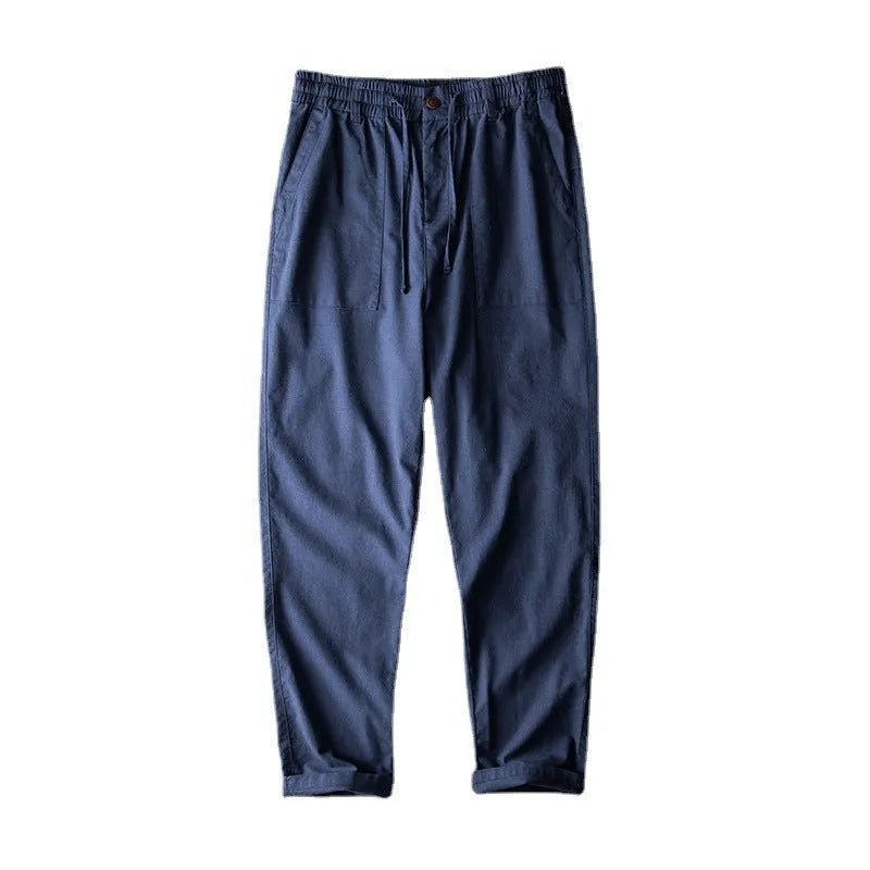 Men's solid colour linen casual trousers in navy blue, shown from the front.