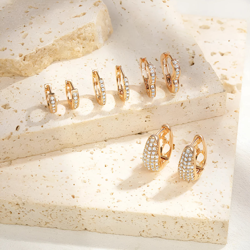 Copper heart-shaped ear clip earrings with gold electroplating and zircon stone accents