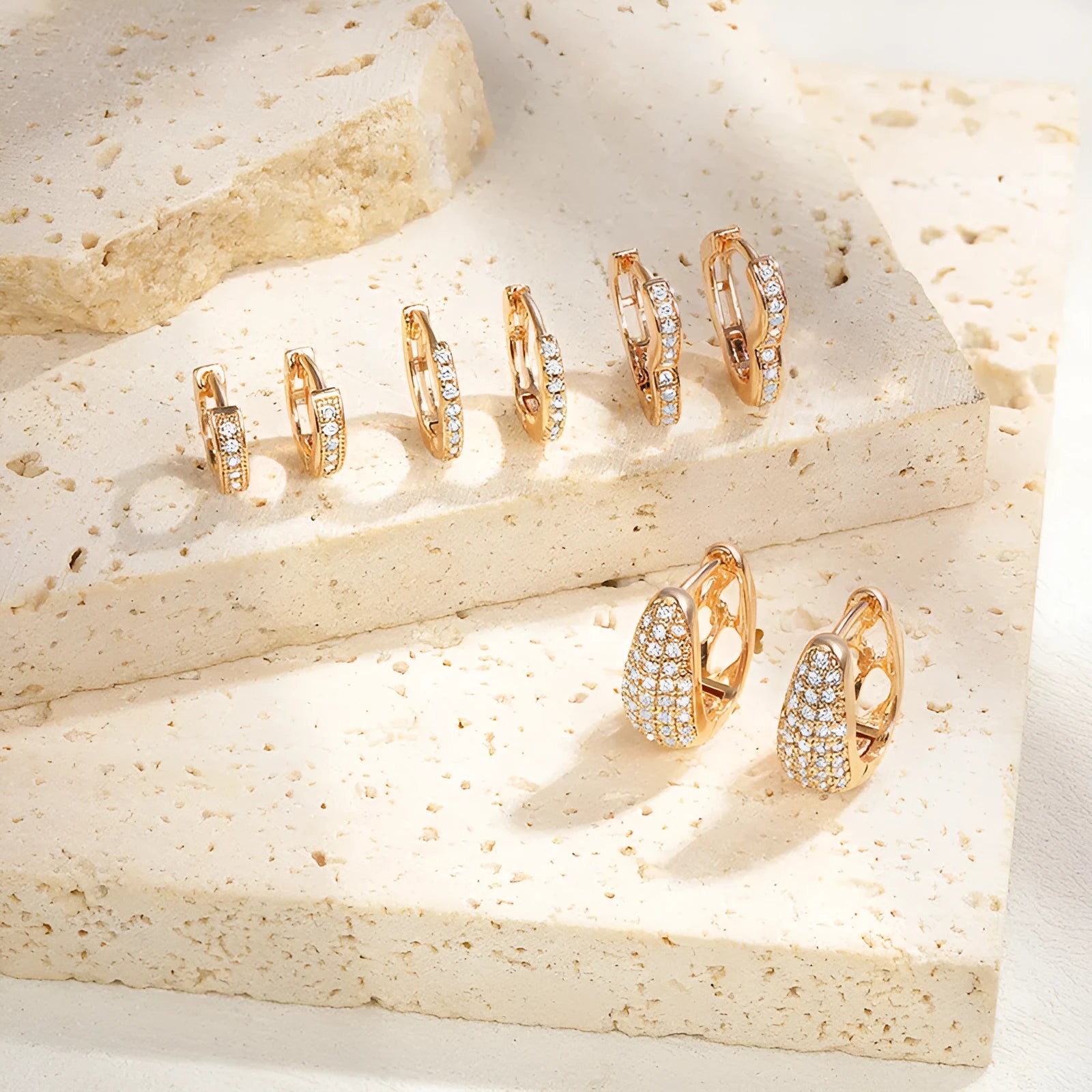 Copper heart-shaped ear clip earrings with gold electroplating and zircon stone accents
