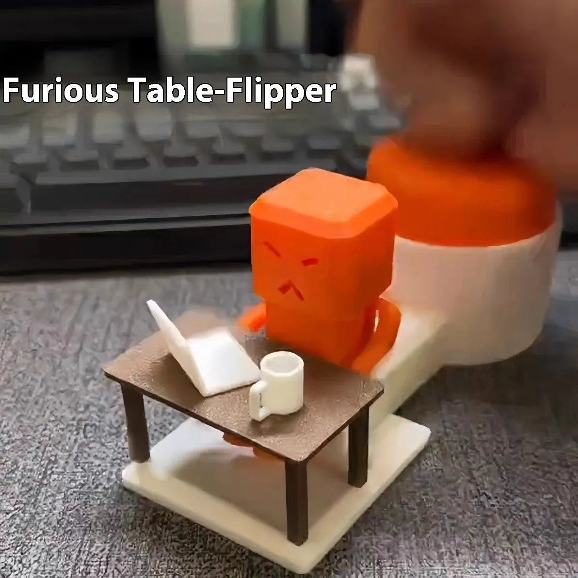 Orange plastic vent-themed table spinning decompression fidget toy on a desk.