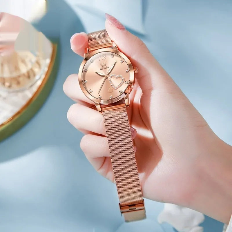 Women's rose shell case fashion watch with mesh strap, showing multiple dial colour options.