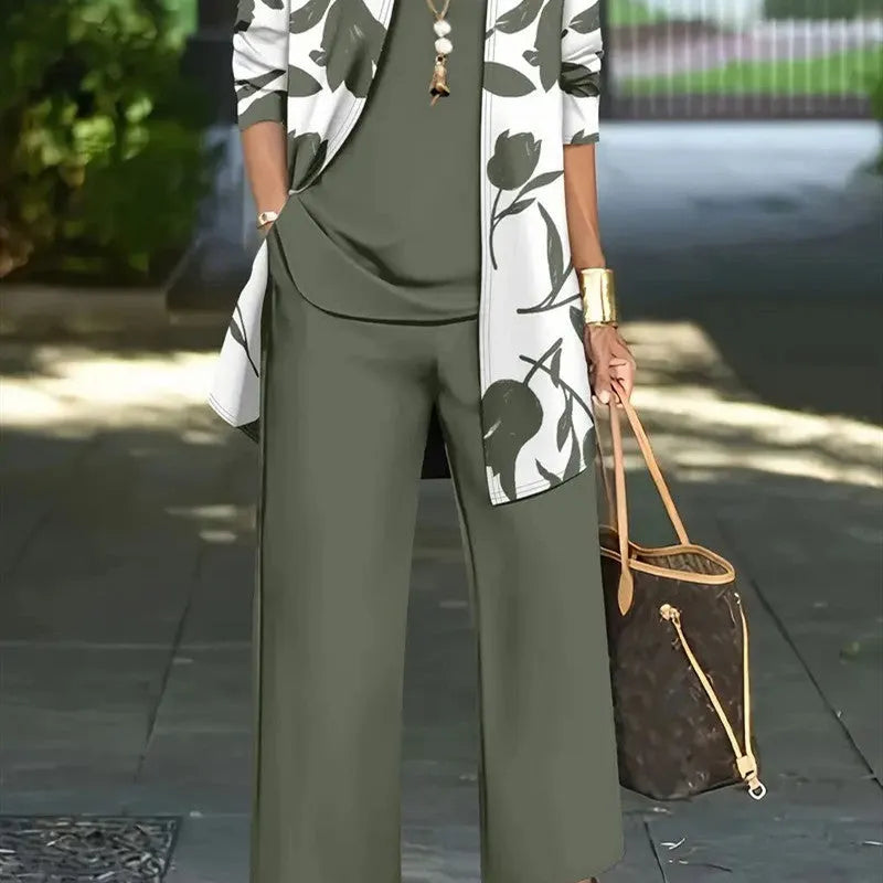 Women's blue three-piece casual suit comprising a long-sleeve coat, a vest, and trousers on a hanger.