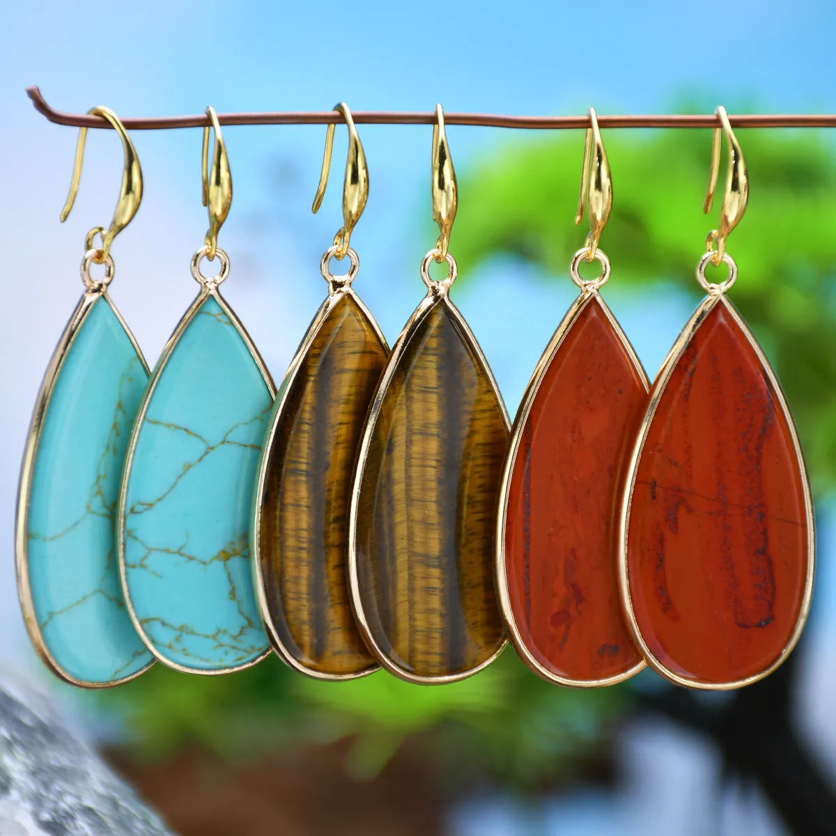 Vintage Tigereye stone drop earrings with handcrafted texture details and water drop pendant shape