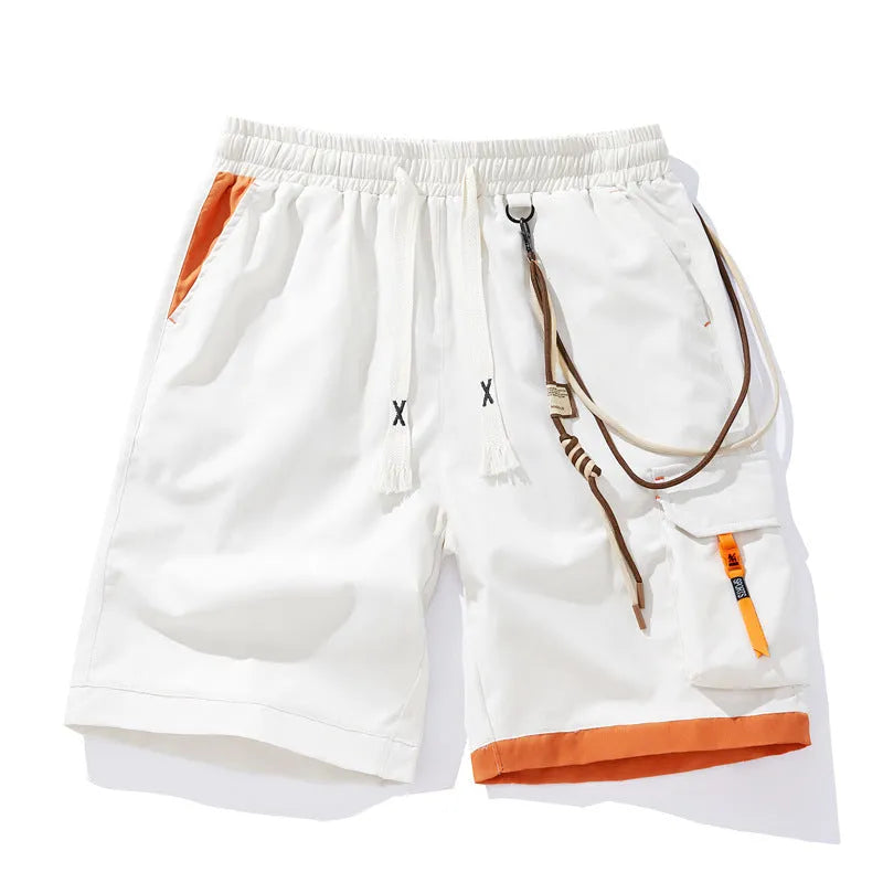 Man wearing coffee-coloured loose-fit bamboo fibre sports shorts with a straight leg and cropped length.