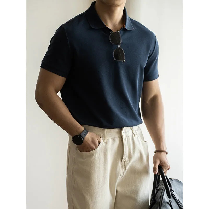 American-style short-sleeved polo shirt in blue cotton blend fabric on hanger