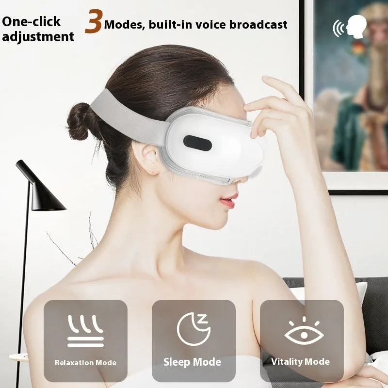 White rechargeable eye massager with airbag compression and hot compress functions for relieving eye fatigue