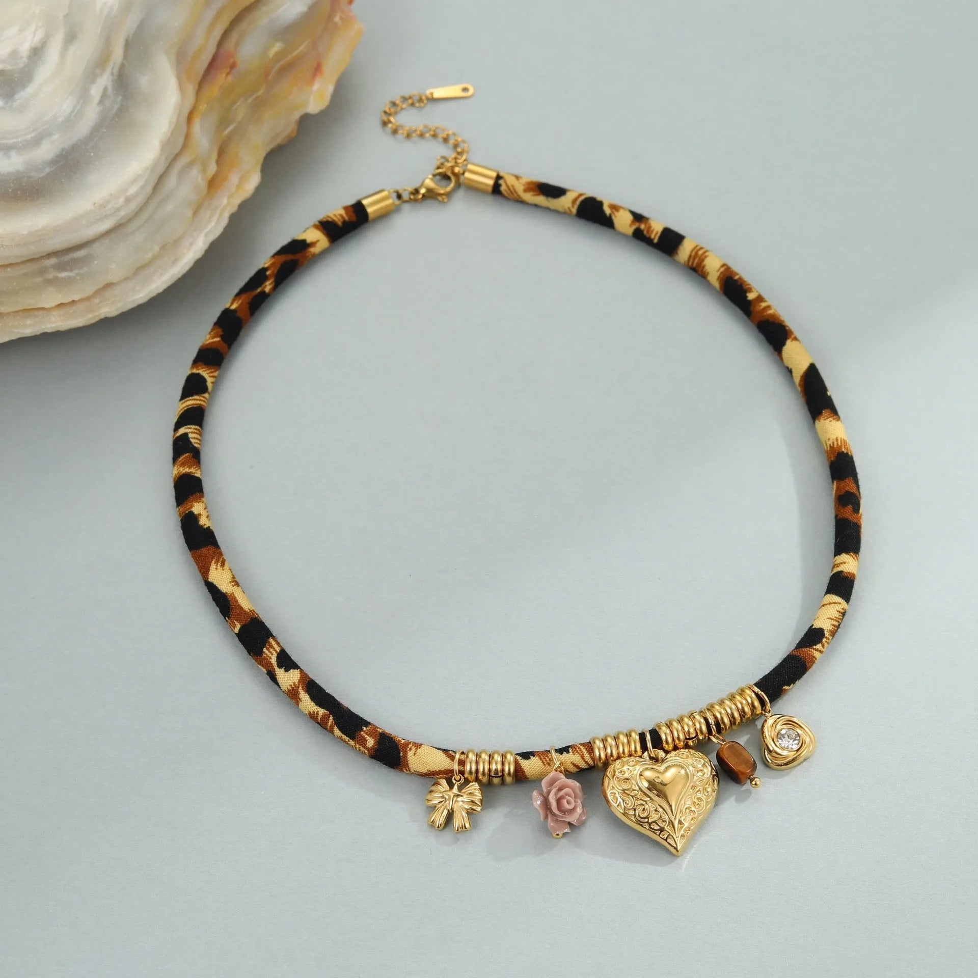 Leopard Series geometric stainless steel necklace with gold electroplated finish on a white background.