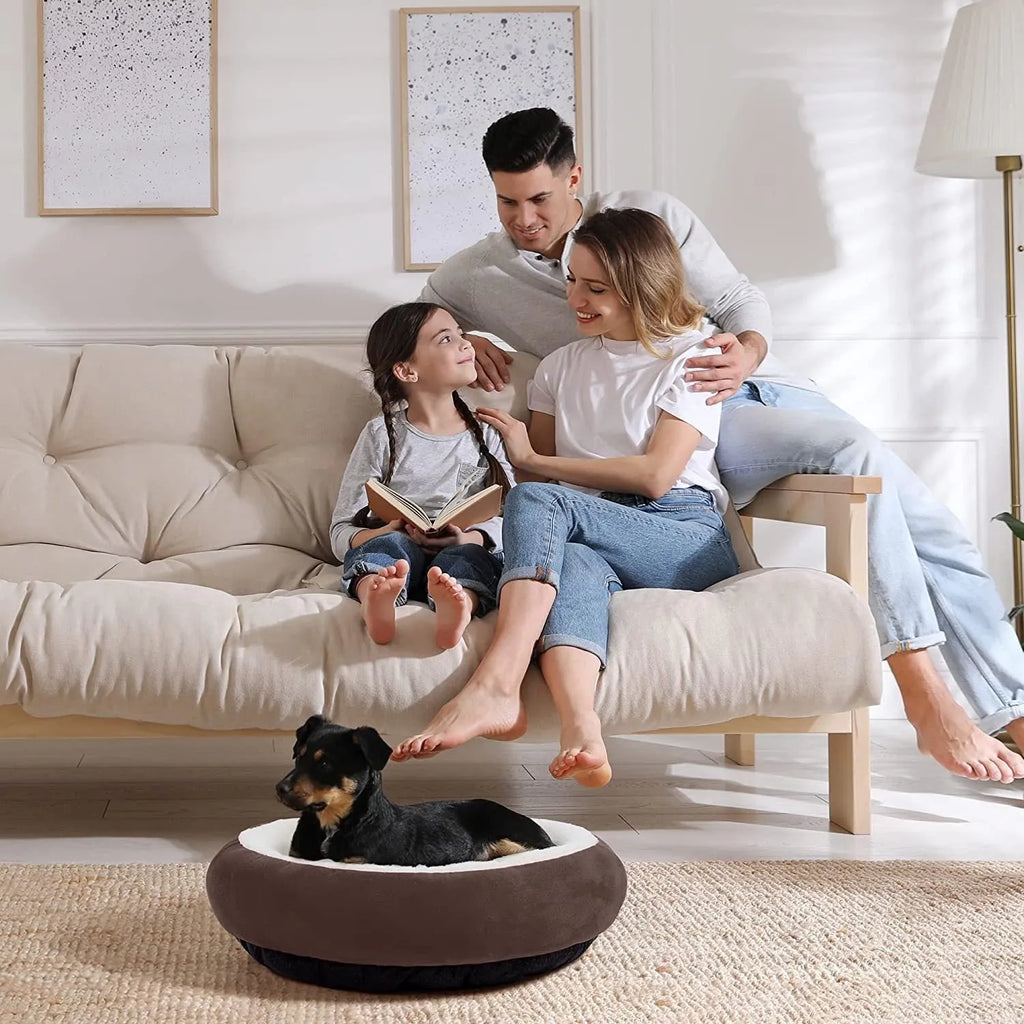 Circular warm soft pet nest dog bed in gray cloth with raised rim, size S, on a wooden floor