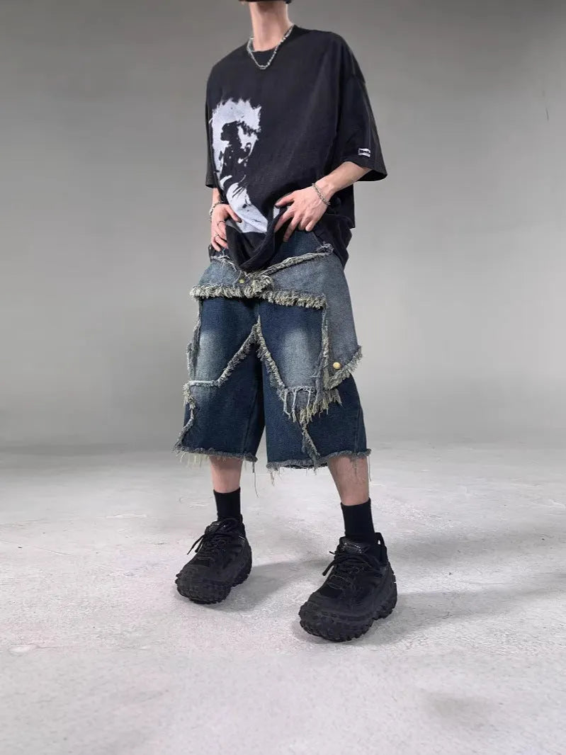 Blue denim shorts with frayed five-pointed star decoration in loose retro style