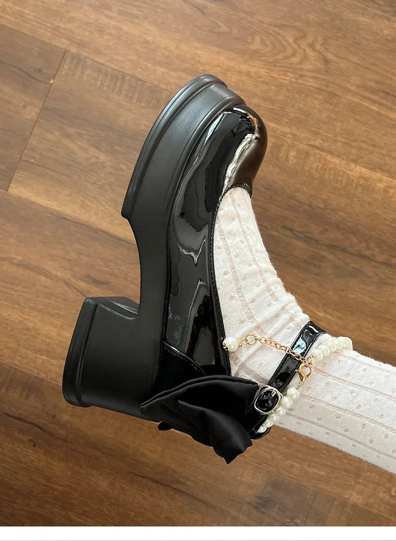 Women's black Mary Jane shoes with chunky 6cm heel and round toe, showing shallow vamp opening